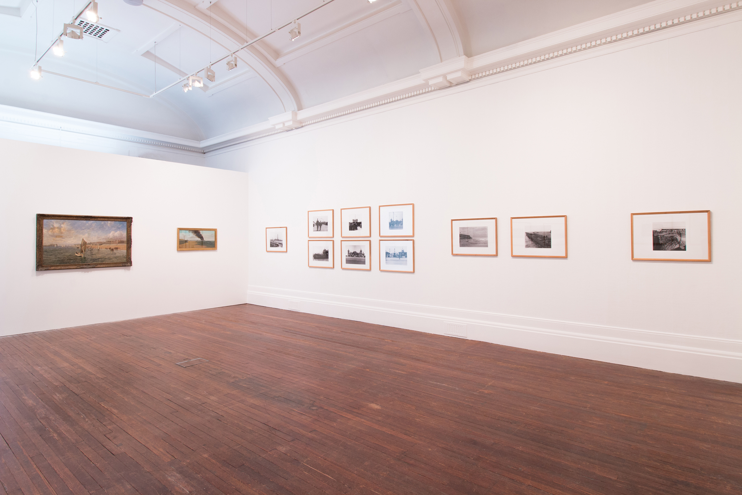 A selection of paintings and photographs showing Blackpool's piers, part of an exhibition depicting modern and historical images of Blackpool's various piers.